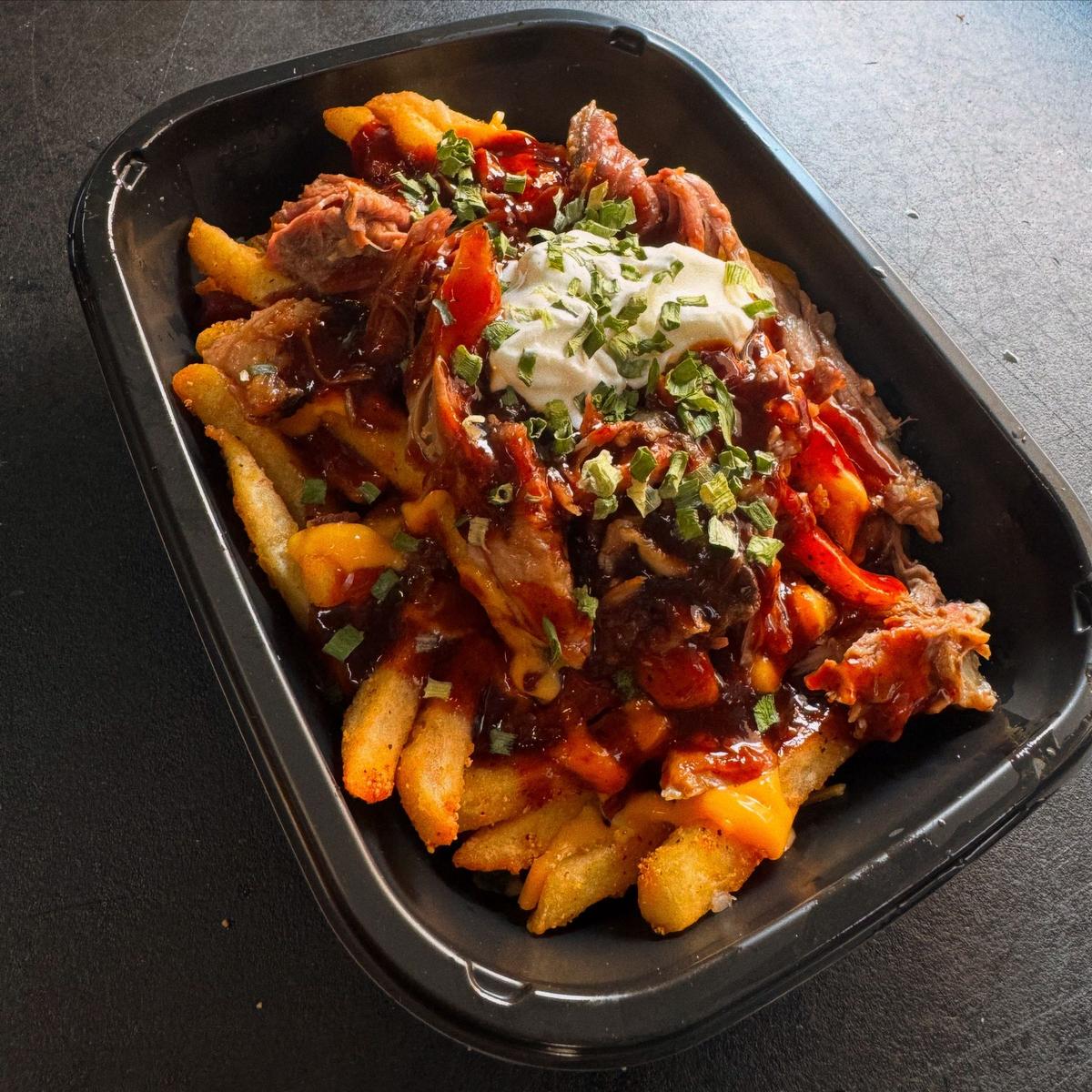 Loaded brisket fries with cheese, sour cream and scallions from Rolling Smokehouse food truck Hartford County CT